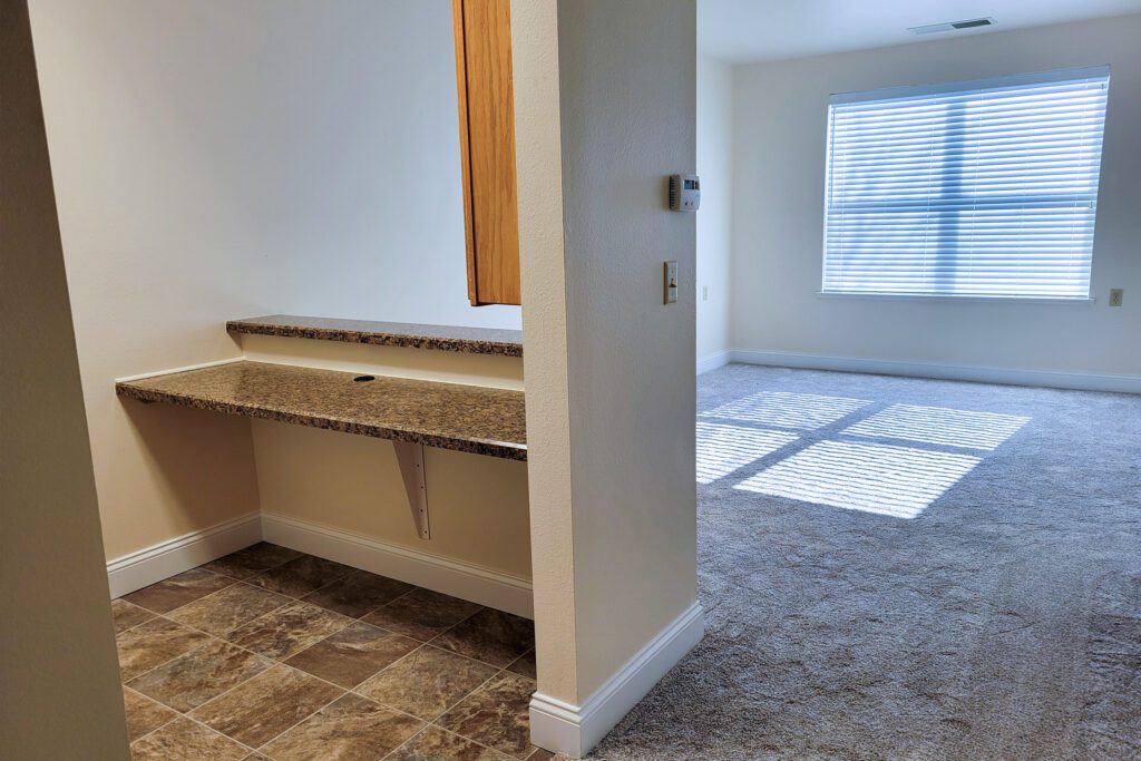 The Vista apartment kitchen and living room view